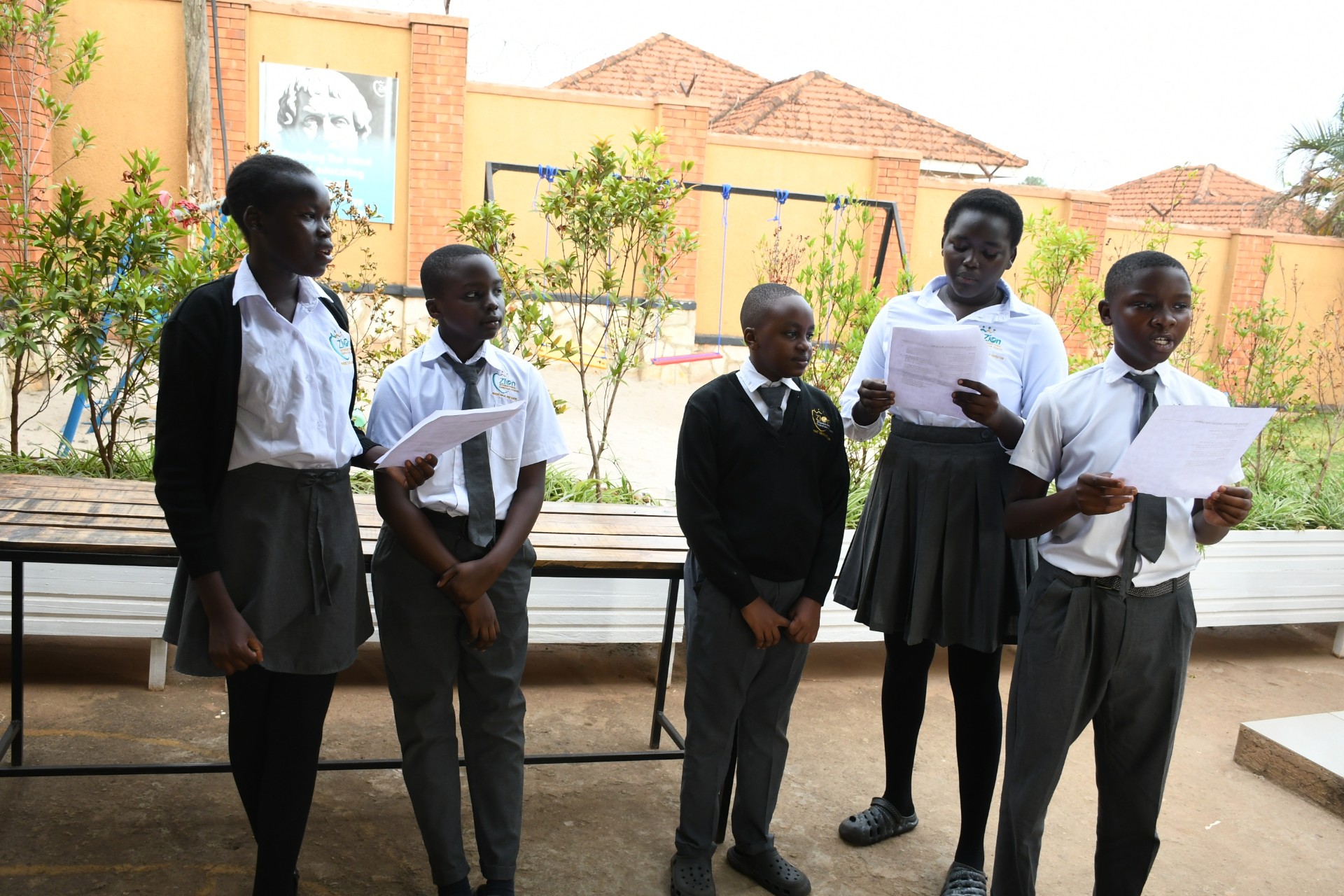 Students engaged in a sports activity on the school field.